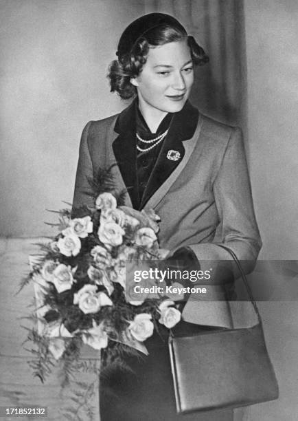 Princess Josephine-Charlotte of Belgium carrying a bouquet, circa 1952.