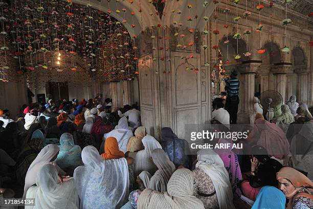 Pilgrims gather at a Sikh shrine in Lahore on June 29 on the 174th death anniversary of Maharaja Ranjit Singh. Singh was also known as...