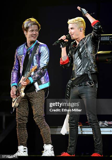 Guitarist Nash Overstreet and singer/guitarist Ryan Follese of Hot Chelle Rae perform as the band opens for Justin Bieber at the MGM Grand Garden...