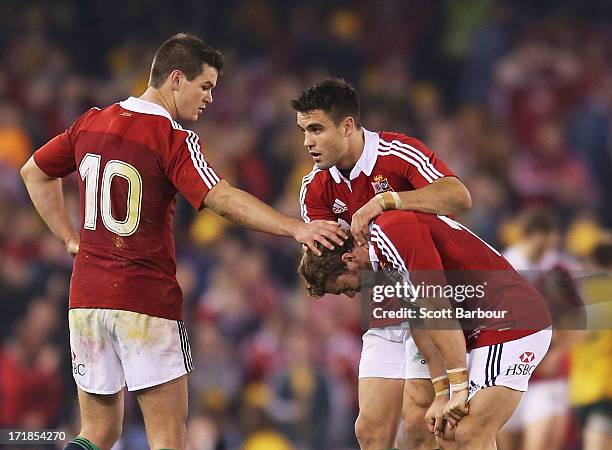 Leigh Halfpenny of the Lions is consoled by his teammates after missing a penalty kick in the final minute of the match during game two of the...