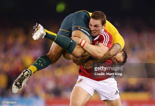 George North of the Lions lifts Israel Folau of Wallabies while carrying the ball during game two of the International Test Series between the...