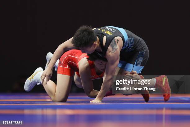 Akari Fujinami of Japan and Pang Qianyu of China competes in the Women's Freestyle 53Kg Gold Medal Match Wrestling event during the 2022 Asian Games...