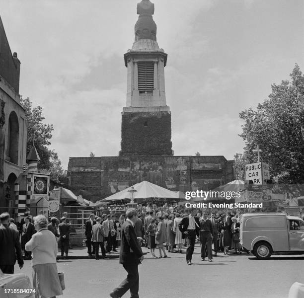 Crowds of people gather in the square opposite St Anne's church during the Soho Fair, London, July 13th 1958.