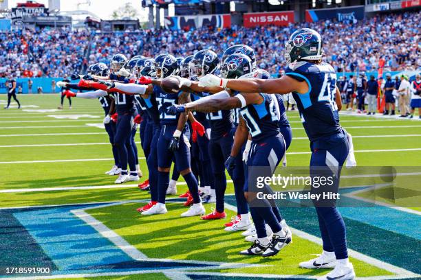 Tennessee Titans defense celebrates after a turnover during the game against the Cincinnati Bengals at Nissan Stadium on October 1, 2023 in...