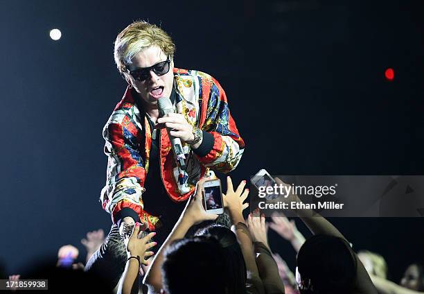 Guitarist Nash Overstreet of Hot Chelle Rae performs as the band opens for Justin Bieber at the MGM Grand Garden Arena on June 28, 2013 in Las Vegas,...