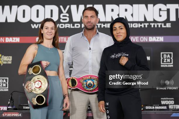 Terri Harper of Great Britain, promoter Eddie Hearn and Cecilia Braekhus of Norway pose for a photo during a press conference ahead of the Leigh Wood...