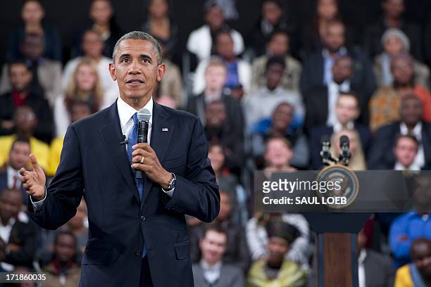President Barack Obama answers a question during a town hall meeting at the University of Johannesburg Soweto in Johannesburg, South Africa, on June...
