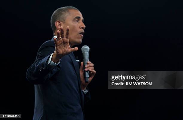 President Barack Obama gestures as he speaks during a town hall style meeting at the University of Johannesburg Soweto in Johannesburg, South Africa,...