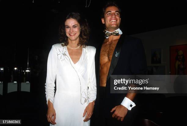 Christie Hefner and a male bunny at the re-opening of the Playboy Club in New York City, October 29, 1985.