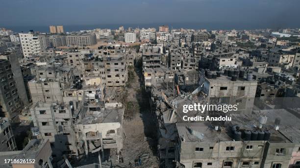 An aerial view of destroyed buildings and debris at the Al-Karama neighborhood after an Israeli airstrike that has been going on for five days in...