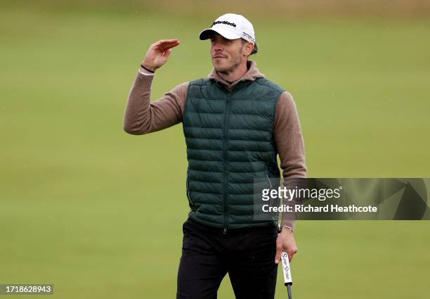 Former Footballer, Gareth Bale gestures on the 14th hole during Day One of the Alfred Dunhill Links Championship at Carnoustie Golf Links on October...