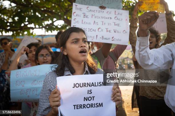 People wave placards and chant slogans as they protest against the arrest of NewsClick’s founder and editor-in-chief Prabir Purkayastha and Amit...