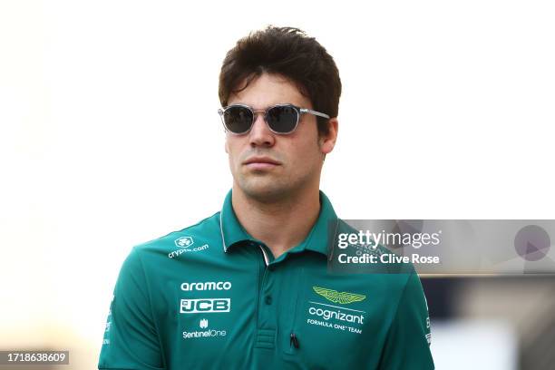 Lance Stroll of Canada and Aston Martin F1 Team walks in the Paddock during previews ahead of the F1 Grand Prix of Qatar at Lusail International...