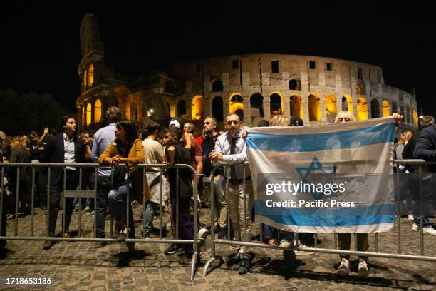 Flag of Israel in front of the Colosseum in Rome during the torchlight procession in support of Israel organized by the newspaper 'Il Foglio' at the...