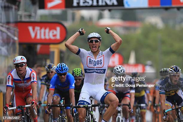 Marcel Kittel of Germany and Argos-Shimano celebrates after winning stage one of the 2013 Tour de France, a 213KM road stage from Porto-Vecchio to...