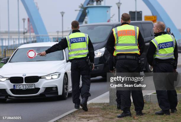 German police check vehicles arriving from Poland at a temporary border checkpoint on October 05, 2023 in Frankfurt an der Oder, Germany. Germany is...