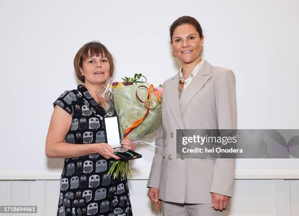 Crown Princess Victoria of Sweden with Elin Röös, winner of Marie-Claire Cronstedt Prize, during WWF's autumn meeting at Ersta konferens on October...