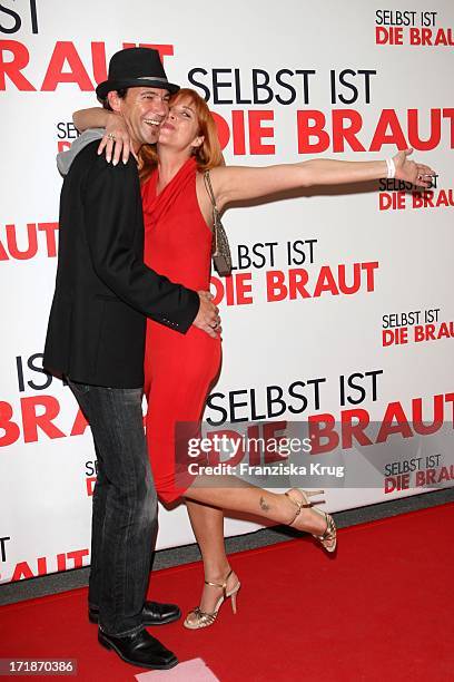 Peter Kanitz And Friend Olivia Pascal at the Premiere Of Germany movie "Even If The Bride" In Mathäser movie palace in Munich