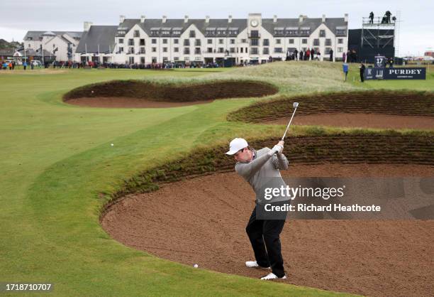 Robert MacIntyre of Scotland plays a shot from a bunker on the 18th hole during Day One of the Alfred Dunhill Links Championship at Carnoustie Golf...