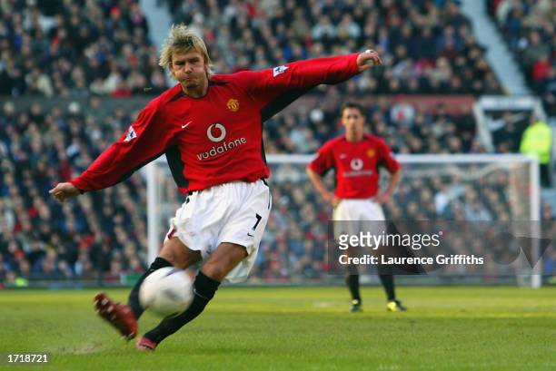David Beckham of Manchester United scores the second goal with a trademark free-kick during the FA Cup third round match between Manchester United...