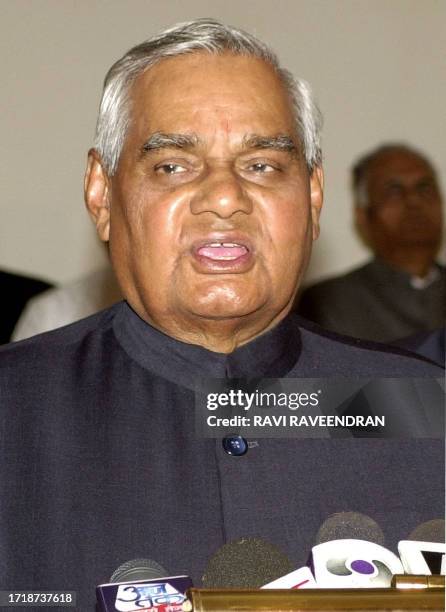 Indian Prime Minister Atal Behari Vajpayee speaks to reporters at Indira Gandhi International Airport in New Delhi 22 February 2003 ahead of his...