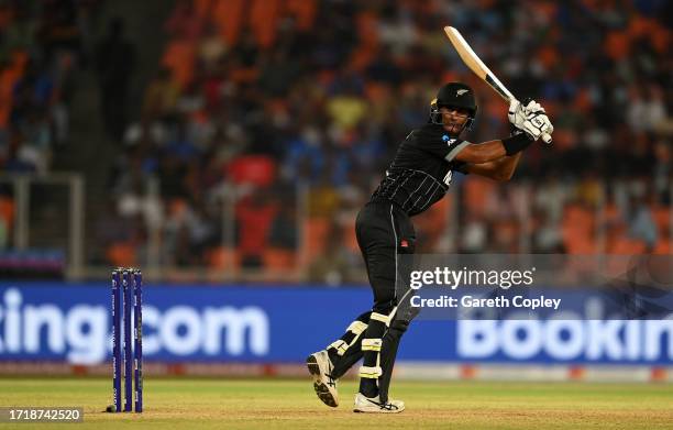 Rachin Ravindra of New Zealand plays a shot during the ICC Men's Cricket World Cup India 2023 between England and New Zealand at Narendra Modi...