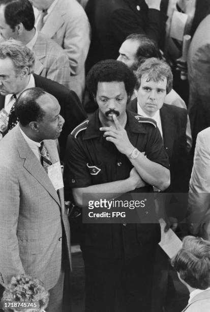 American politician, political activist and Baptist minister Jesse Jackson, his left index finger held to his bottom lip, attends the 1980 Democratic...