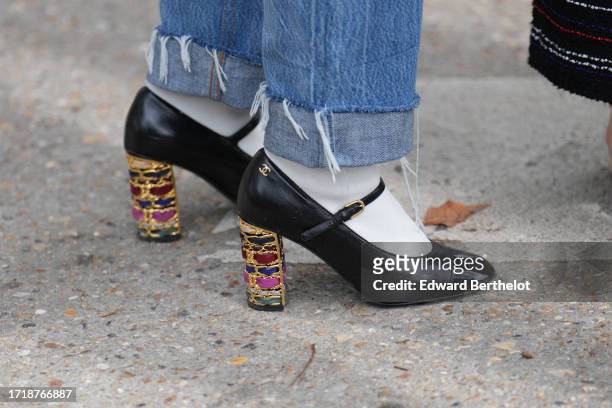 Guest wears Chanel shoes with high colored bejeweled heels, outside Chanel, during the Womenswear Spring/Summer 2024 as part of Paris Fashion Week on...