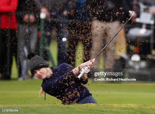 Actress, Kathryn Newton plays a shot from a greenside bunker on the 18th hole during Day One of the Alfred Dunhill Links Championship at Carnoustie...