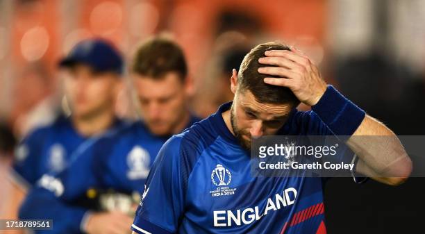 Chris Woakes of England cuts a dejected figure following the ICC Men's Cricket World Cup India 2023 between England and New Zealand at Narendra Modi...