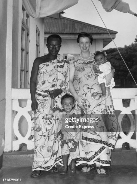 Ghanaian politician and lawyer Joe Appiah, wearing a Kente cloth, with his wife, British author and socialite Peggy Cripps, and their children, Kwame...