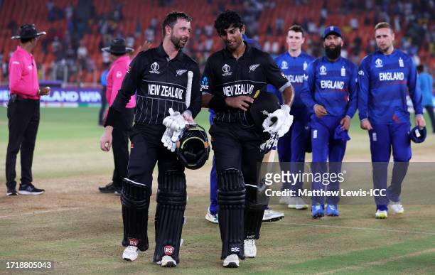 Devon Conway and Rachin Ravindra of New Zealand make their way off after an unbeaten 273 partnership following the ICC Men's Cricket World Cup India...