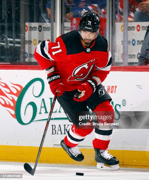 Jonas Siegenthaler of New Jersey Devils skates against the New York Rangers at Prudential Center on October 04, 2023 in Newark, New Jersey.