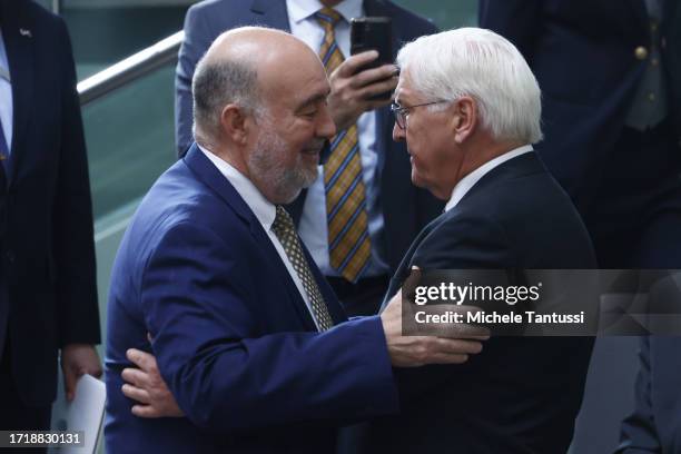 President Frank-Walter Steinmeier and Ambassador of State Israel to Germany Ron Prosor embrace as they observe a moment of remembrance at the...