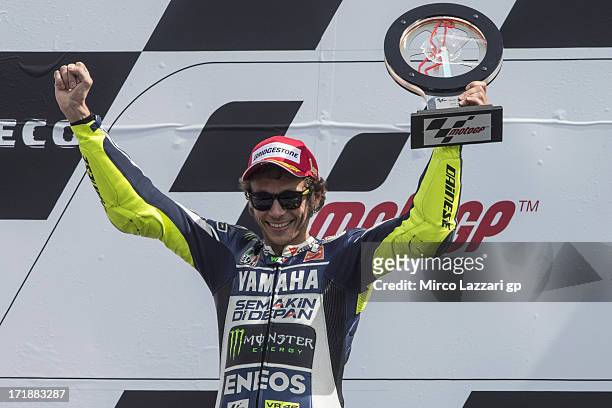 Valentino Rossi of Italy and Yamaha Factory Racing celebrates victory on the podium at the end of the MotoGP race during the MotoGp Of Holland - Race...
