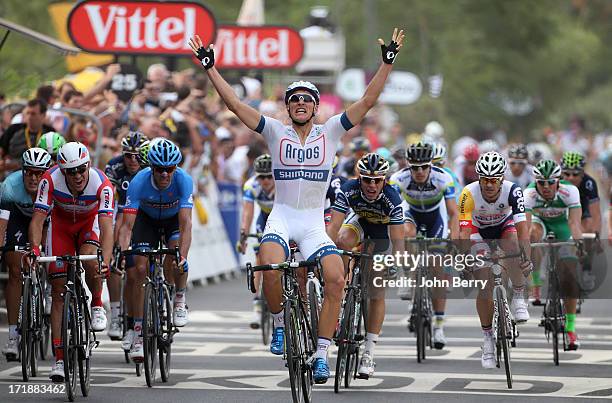 Marcel Kittel of Germany and Team Argos-Shimano wins Stage One and wears the first yellow jersey of the Tour de France 2013 on June 29, 2013 in...