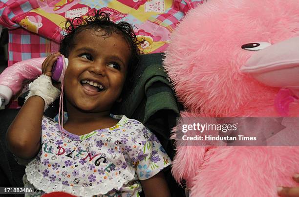 Two-year-old girl who separated from her parents and rescued after flood disaster in Uttarakhand smile as she was hoping to hear voice of her father...