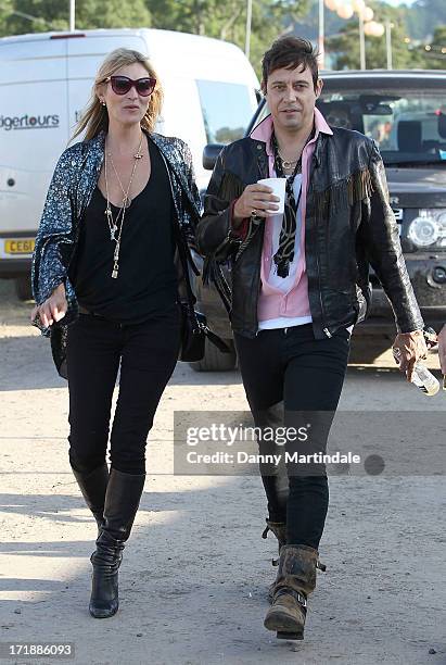 Kate Moss and Jamie Hince attend day 3 of the 2013 Glastonbury Festival at Worthy Farm on June 29, 2013 in Glastonbury, England.