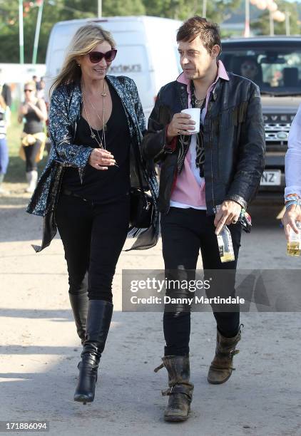 Kate Moss and Jamie Hince attend day 3 of the 2013 Glastonbury Festival at Worthy Farm on June 29, 2013 in Glastonbury, England.