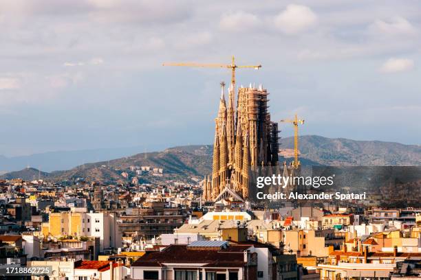 barcelona cityscape with sagrada familia on a sunny day, catalonia, spain - familia stock pictures, royalty-free photos & images