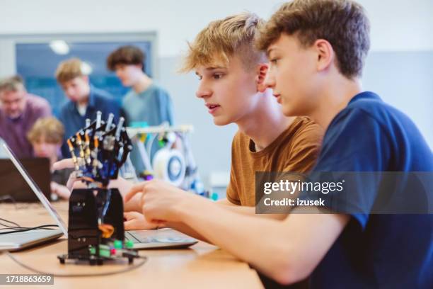 two high school students during robotics programming lesson - computer lab kids stock pictures, royalty-free photos & images