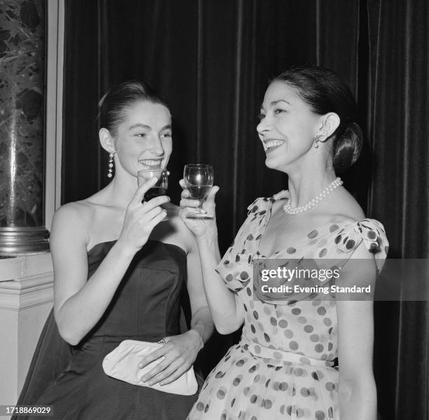 Ballerinas Anya Linden, left, and Dame Margot Fonteyn having a drink together, September 1st 1958.