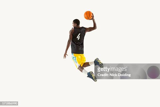 flying basketball player 05 - posizione sportiva foto e immagini stock