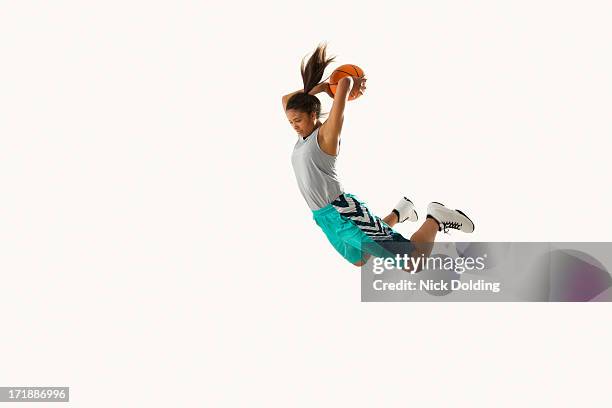 flying basketball player 13 - women athletics stock pictures, royalty-free photos & images