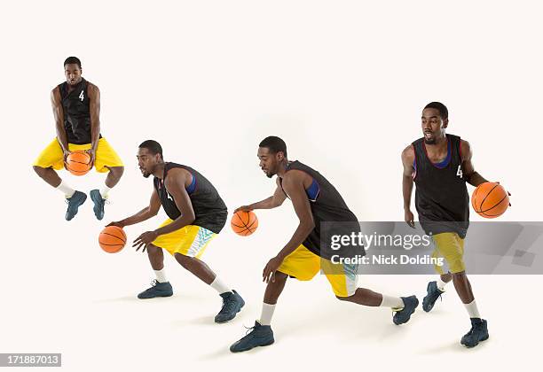 basketball players 23 - dribbling sports stock-fotos und bilder