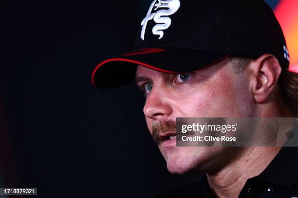 Valtteri Bottas of Finland and Alfa Romeo F1 talks to the media in the Paddock during previews ahead of the F1 Grand Prix of Qatar at Lusail...