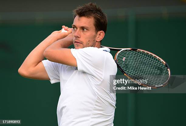 Frederik Nielsen of Denmark plays a backhand during their Gentlemen's Doubles second round match between Grigor Dimitrov of Bulgaria and Frederik...