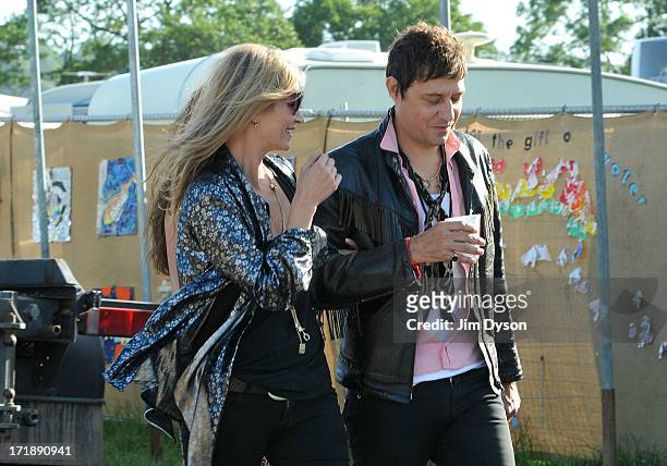 Kate Moss and Jamie Hince are pictured backstage during day 3 of the 2013 Glastonbury Festival at Worthy Farm on June 29, 2013 in Glastonbury,...