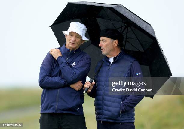 Bill Murray and Andy Garcia of The United States the Hollywood actors wait to putt on the third green during the first round of the Alfred Dunhill...