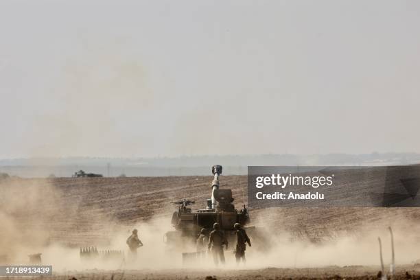 Smoke rises as Israeli artillery units stationed in the military zone launch attacks during the fifth day of the clashes in Sderot, Israel on October...